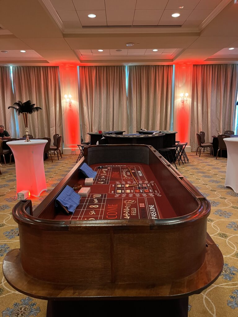 Casino craps table with nice tables at the back