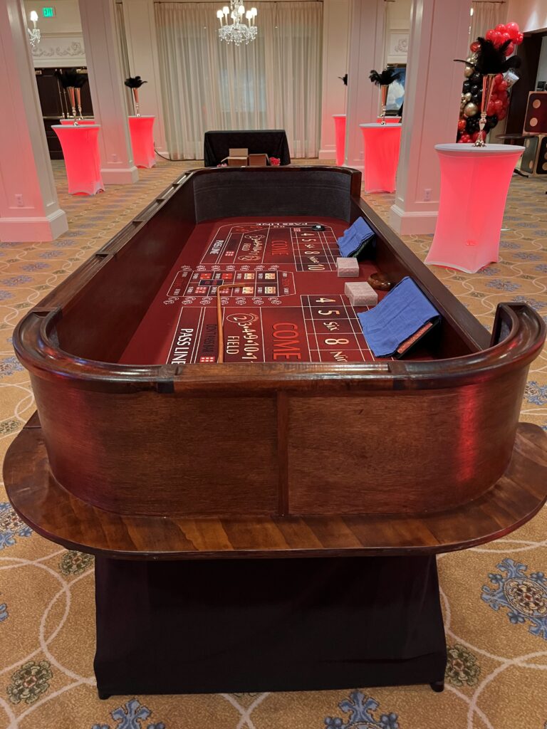 Casino craps table with tables at the back