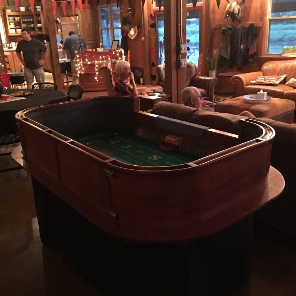 Casino craps table with people at the back