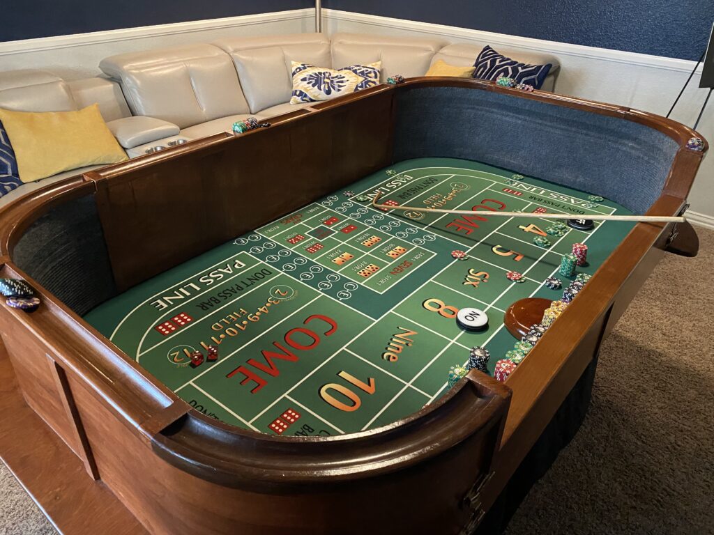 Casino craps table with a sofa at the back
